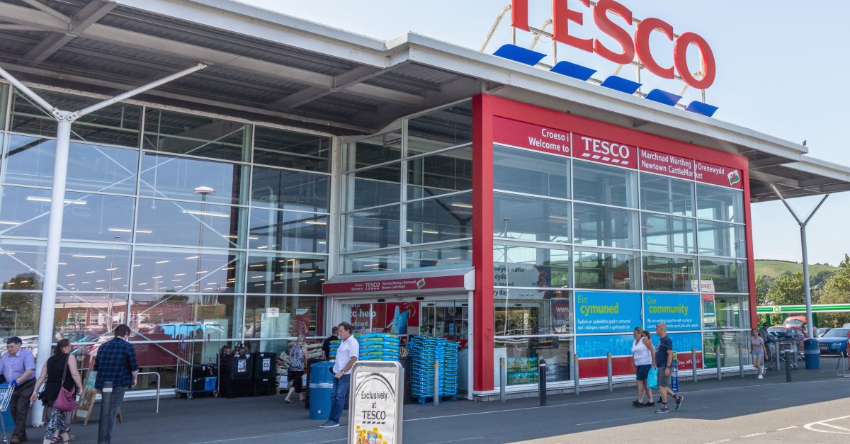 FTSE 100: Tesco profit halves to £1bn amid higher costs