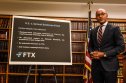 Damian Williams US attorney Damian Williams in front of board listing allegations against Sam Bankman-Fried