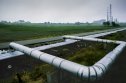 Stock photo of a gas pipeline running through farmland in Norway