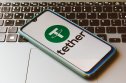 Tether In this photo illustration the Tether logo seen displayed on a smartphone
