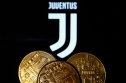 Juventus Representation of cryptocurrency in front of Juventus football club logo
