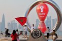 Qatar 2022 FIFA World Cup countdown clock A picture taken on 20 October, 2022, shows people walking past the Qatar 2022 FIFA World Cup countdown clock as it nears marking thirty days, in the Qatari capital Doha