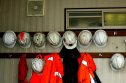 Australia is trying to be less reliant on its mining economy but that's doing little to support AUD currently Miners helmets hang on hooks outside a mine office at a gold and copper mine.