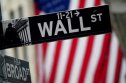 A file photo shows a Wall Street sign outside the New York Stock Exchange in New York City, New York, U.S., October 2, 2020. 