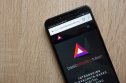 BAT price prediction The basic attention token logo on a smartphone screen