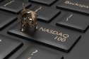NASDAQ 100 forecast 2022 A key on a computer keyboard adapted to say NASDAQ 100, with a small gold bull charm sitting on it