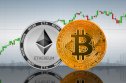 Bitcoin (BTC) and Ethereum (ETH) coins on the background of the chart
