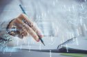 Choosing a digital wallet Financial forex graph displayed on hands taking notes background. Concept of research. Double exposure
