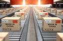 China interest rate forecast for next 5 years Cardboard boxes with Chinese-made text and a Chinese flag on a roller conveyor.