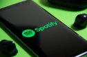 Spotify (SPOT) A image of the Spotify logo on a smartphone