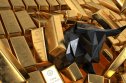 gold Bull smashing gold bars