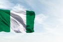 nigeria inflation rate Nigeria flag in the blue sky. Horizontal panoramic banner.