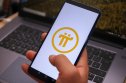 Pi Network logo Pi Network logo displayed on a smartphone