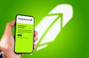 Cell phone with Robinhood logo. Source: Shutterstock_1960476235.jpeg
