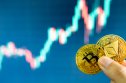 ETH to BTC prediction Bitcoin and ethereum coins held together, candle charts on the background.