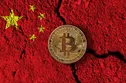 Bitcoin cryptocurrency coin with a cracked China flag