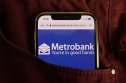 Metropolitan Bank stock price forecast: Will our MCB stocks come as a surprise despite the crypto winter?  The Metropolitan Bank and Trust Company logo appears on your mobile phone