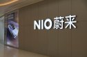nio short squeeze interest large NIO store sign and Chinese brand name