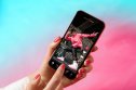 A phone display with Tik Tok app opened. A phone display with Tik Tok app opened.