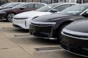 Lucid Motors capital raise Lucid card standing in a row.