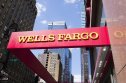 Wells Fargo (WFC) stock forecast New York, New York, USA - May 31, 2012: A Wells Fargo sign at a Wells Fargo location in Midtown Manhattan. Manhattan buildings can be seen in the background.