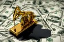 commodities Golden pumpjack and spilled oil on US dollar banknotes