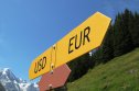 EUR/USD USD-EUR sign and alpine scenery in the background