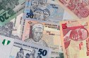 Nigerian naira forecast Nigeria money, heap of various naira banknotes, African nigerian currency