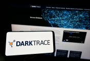 Darktrace logo on mobile phone. Photo:Shutterstock Darktrace logo on mobile phone. Photo:Shutterstock