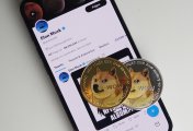 Dogecoin (DOGE) Dogecoins rest on a smartphone displaying Twitter
