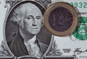 EUR/USD In this photo illustration a Euro coin rest on top of a Dollar note, on November 26, 2010 in London, England.