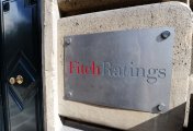 The elimination of the 45p top rate tax is not enough to stop Fitch slashing its UK outlook rating Fitch ratings agency front door plate, 2011, Paris