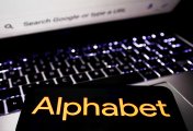 Alphabet logo displayed on a phone screen and Google logo displayed on a laptop screen are seen in this illustration photo taken in Krakow, Poland on October 30, 2021 Alphabet logo displayed on a phone screen and Google logo displayed on a laptop screen are seen in this illustration photo taken in Krakow, Poland on October 30, 2021