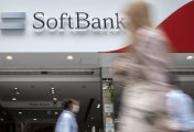SoftBank A image of pedestrians walking past a SoftBank mobile shop in Tokyo