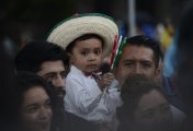 MXN has very close exposure to the US economy which may be in slowdown mode – how will MXN fare? Child celebrating Independence Day, Sept 15 2022