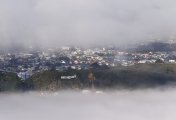New Zealand’s reserve bank says spending levels need to be slashed with rate rises to tame inflation The Wellington ''blown away'' sign surrounded by fog on June 23, 2020