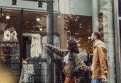 stock market man and women window shopping