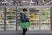 UK shoppers take more budget care Man shopping in a supermarket while on a budget.