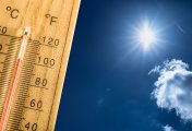 Hot summer day and a hundred fahrenheit on a thermometer Stock photo of a hot summers day and a thermometer