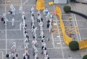 apple foxcomm supply chain factory staff in full body suits