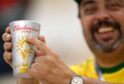 AB InBev (BUD) A image of a football fan holding a Budweiser zero cup