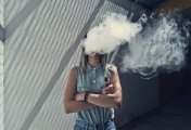 BATS wiman using a vape