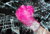 Glass Ceiling Photo of pink boxing glove breaking glass