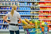 Supermarket food A shopper in a supermarket makes purchasing choices