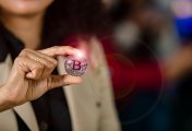 Cryptocurrency Photo of woman holding a coin