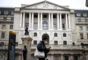 A file photo of a person walking past the Bank of England in the City of London financial district in London, Britain, January 23, 2022. A file photo of a person walking past the Bank of England in the City of London financial district in London, Britain, January 23, 2022.