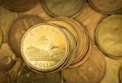 A Canadian dollar coin, commonly known as the A Canadian dollar coin, commonly known as the