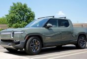 A file photo of a Rivian R1T electric truck is seen outside Munro & Associates headquarters in Auburn Hills, Michigan, U.S., June 3, 2022. A file photo of a Rivian R1T electric truck is seen outside Munro & Associates headquarters in Auburn Hills, Michigan, U.S., June 3, 2022.
