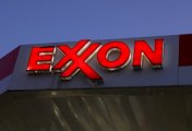 A file photo of signage seen at an Exxon gas station in Brooklyn, New York City, U.S., November 23, 2021. A file photo of signage seen at an Exxon gas station in Brooklyn, New York City, U.S., November 23, 2021.