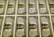 A file photo of United States one dollar bills at the Bureau of Engraving and Printing in Washington in this November 14, 2014. A file photo of United States one dollar bills at the Bureau of Engraving and Printing in Washington in this November 14, 2014.